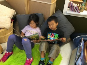 Reading and looking at books at our quiet area.